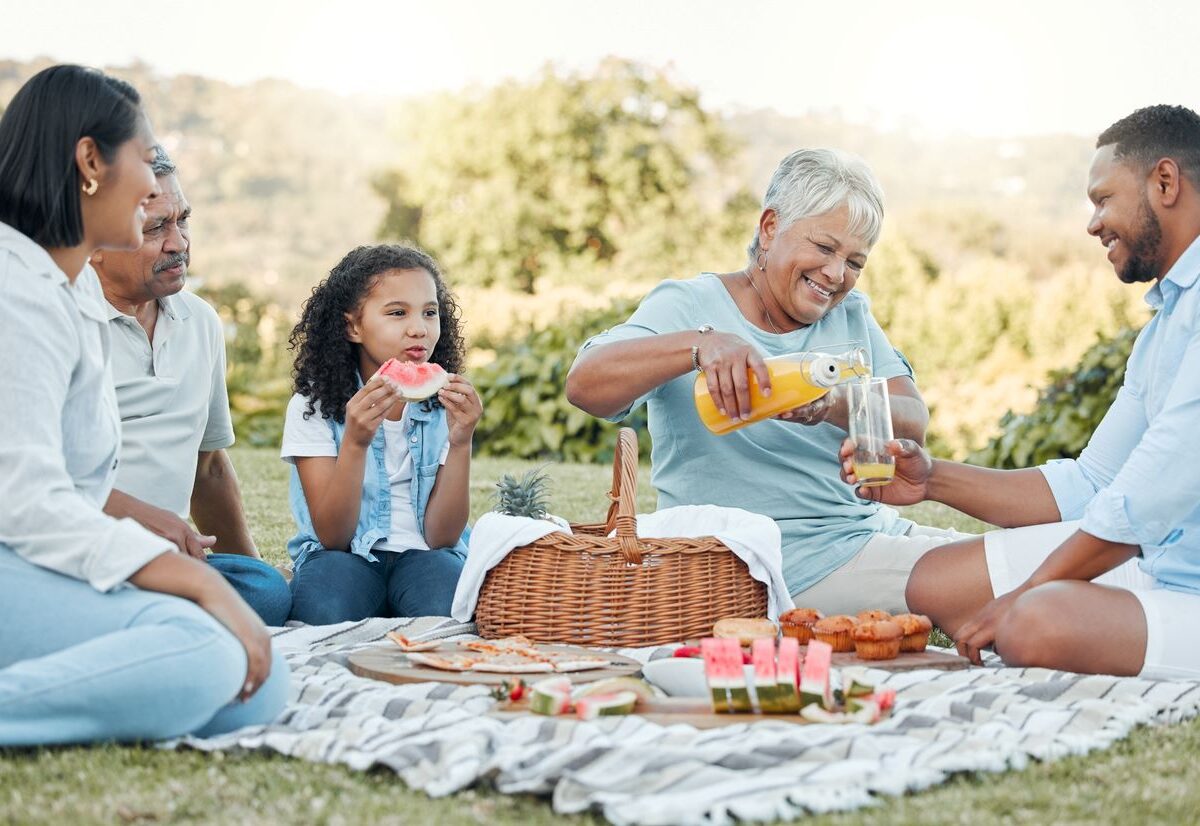 A family enjoys a lovely outdoor picnic together.