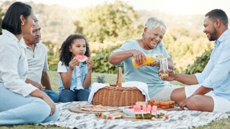 A family enjoys a lovely outdoor picnic together.